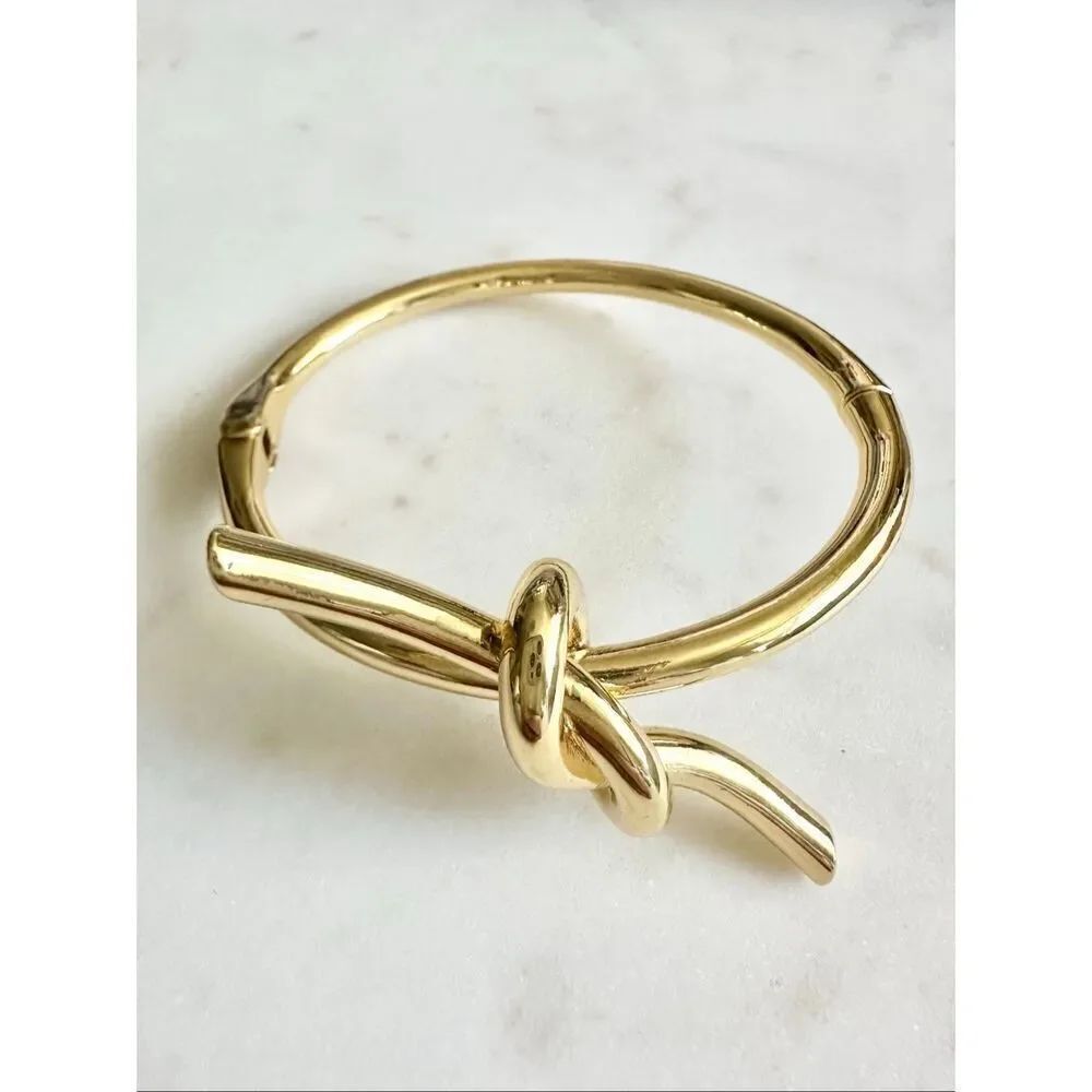 Sleek gold color tie the knot bangle bracelet